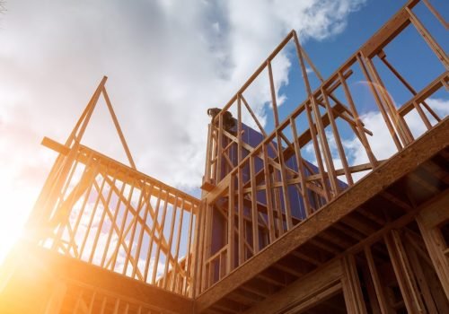 wood-building-frame-new-residential-construction-home-framing-with-roof-view.jpg